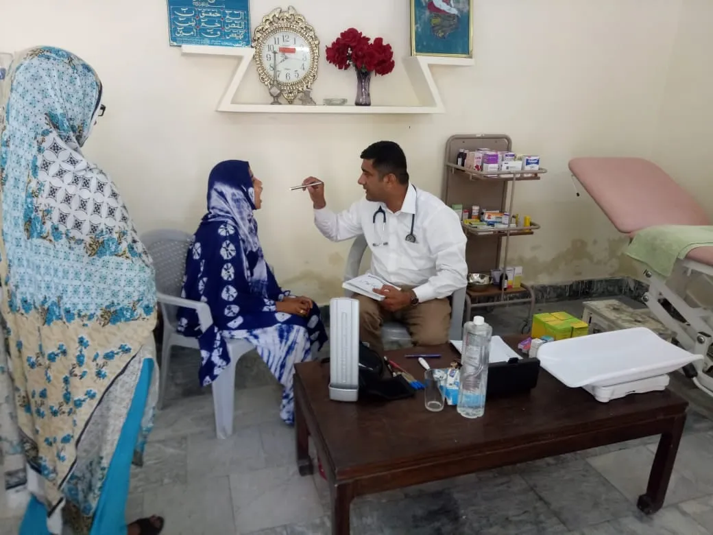 A doctor examines a patient at the Gujar Khan clinic
