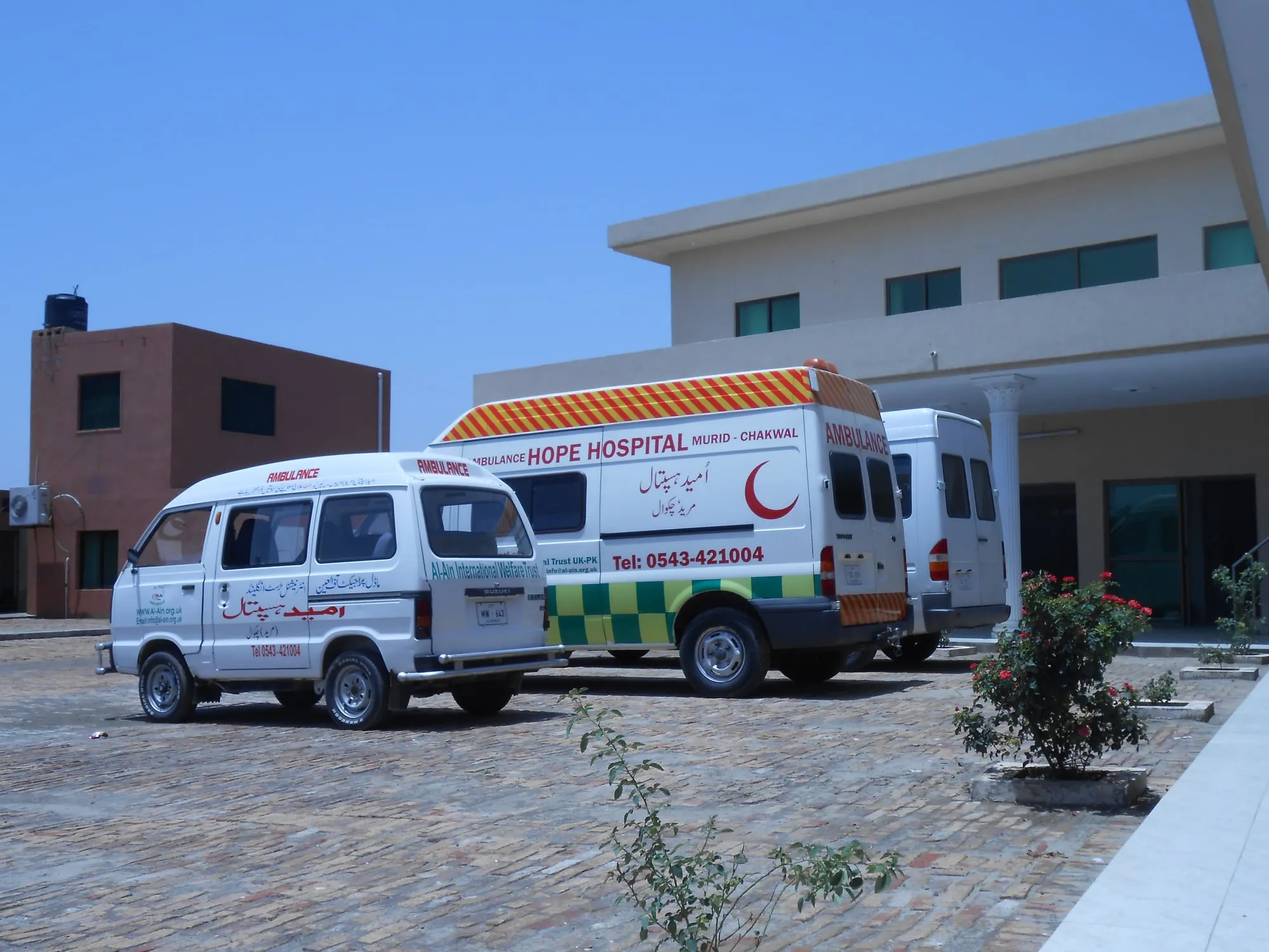 Umeed (Hope) Hospital in Murid, Chakwal, with its ambulances parked outside